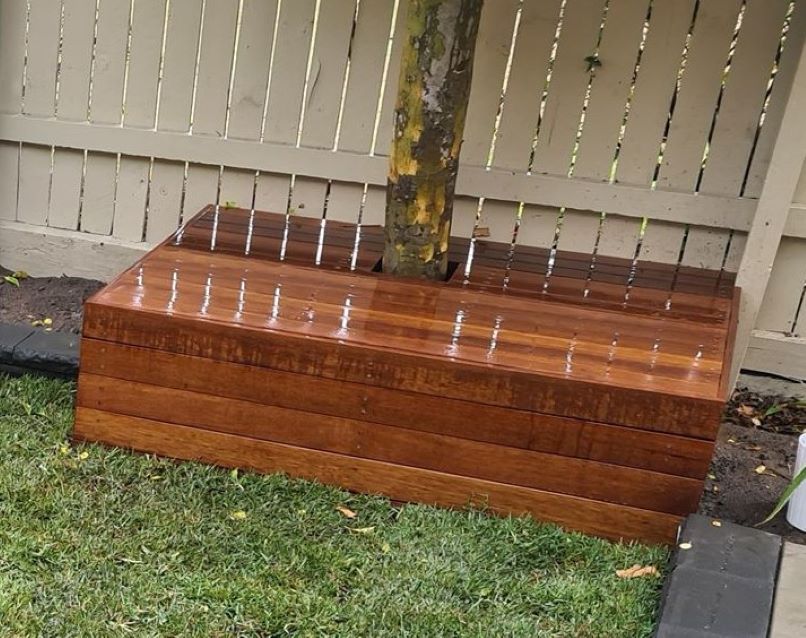 wooden box around tree